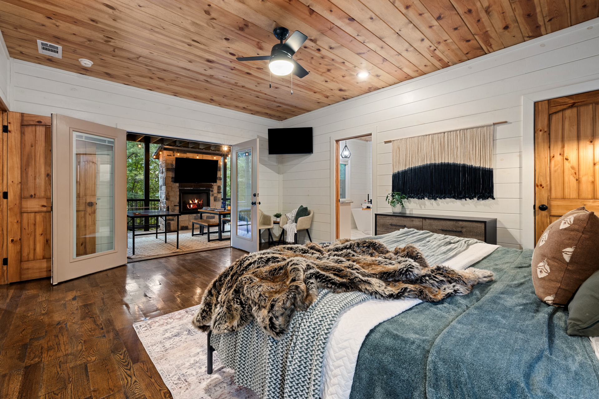 King bedroom comfort with a private ensuite bathroom waiting just beyond the door. 
Soft bedding, warm wood tones, and the kind of peaceful atmosphere that makes sleeping in feel like part of the vacation.