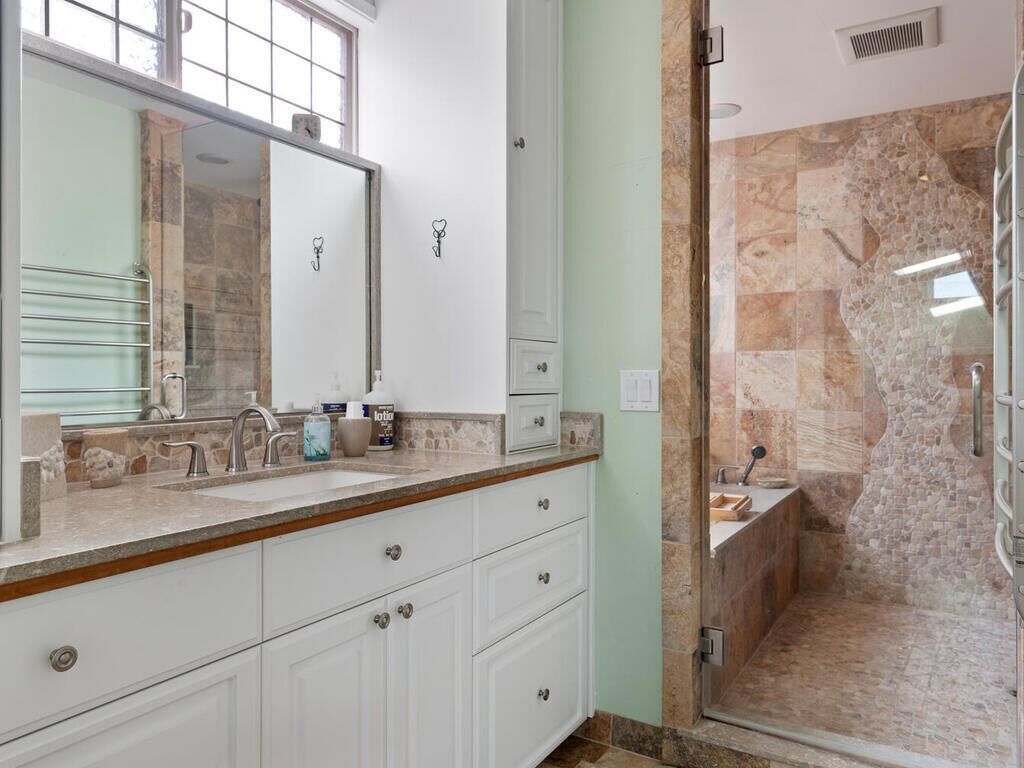 Primary bathroom - walk-in shower w/ dual shower heads and jetted soaking tub