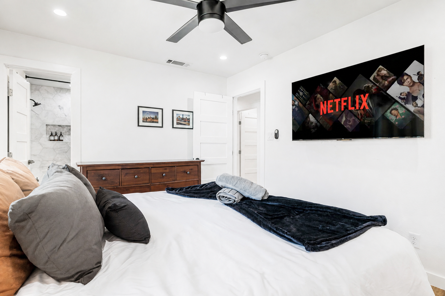 Unwind in style with a plush bed, smart TV, and sleek, modern decor!