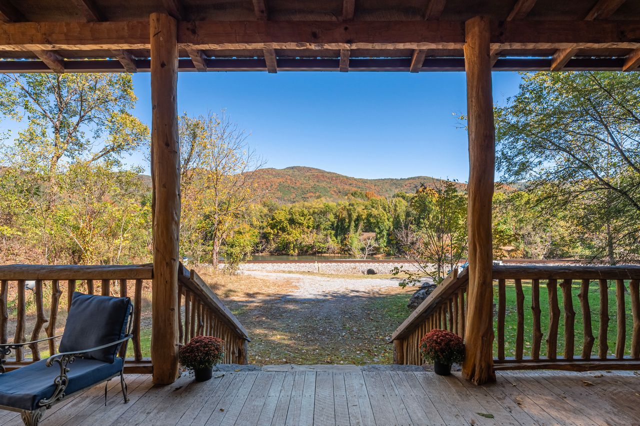 Step out onto the spacious front porch with views of the mountains across the river. 