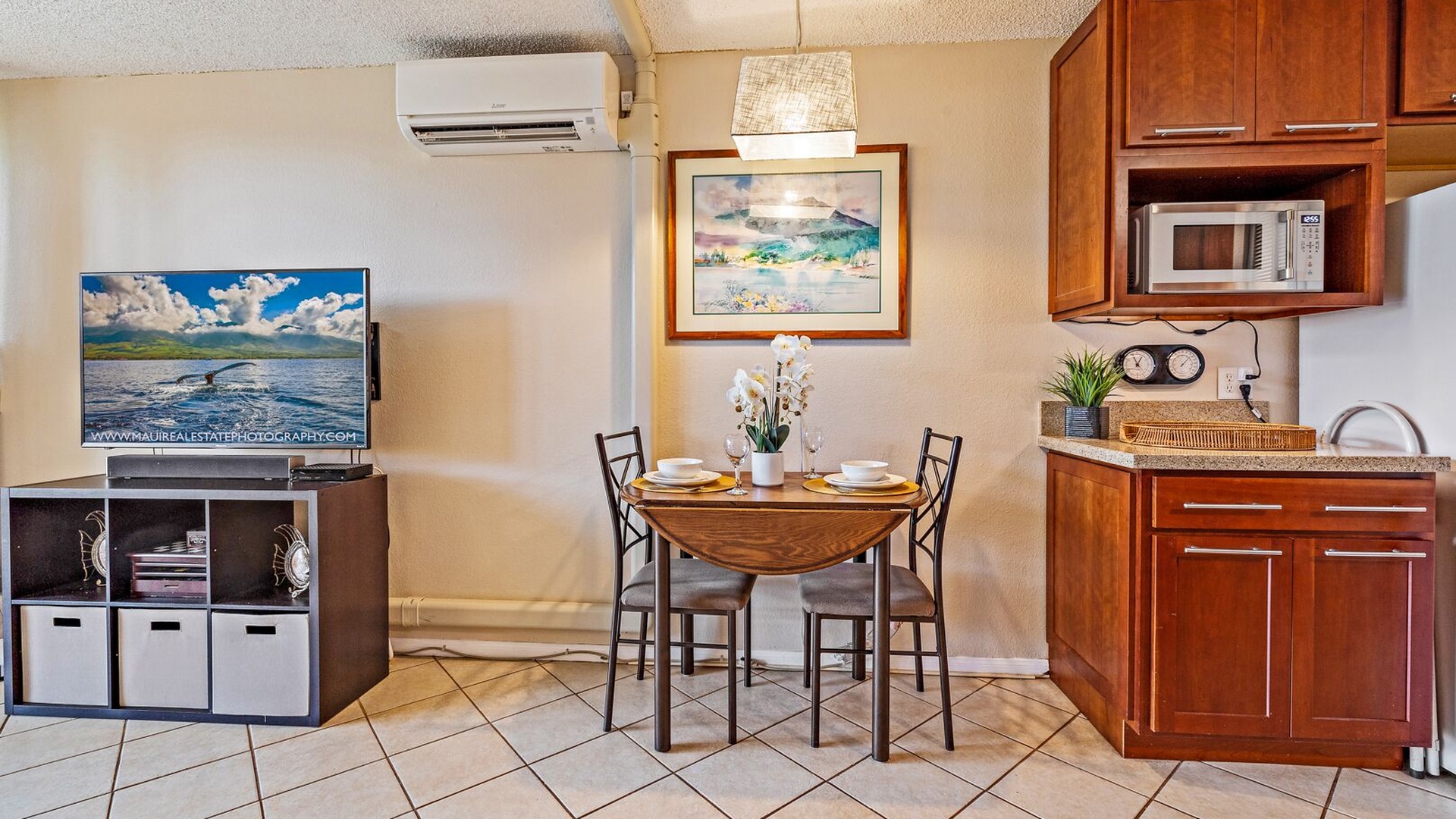 Seating for two at table. Leaves expand & chairs from outside can be used inside