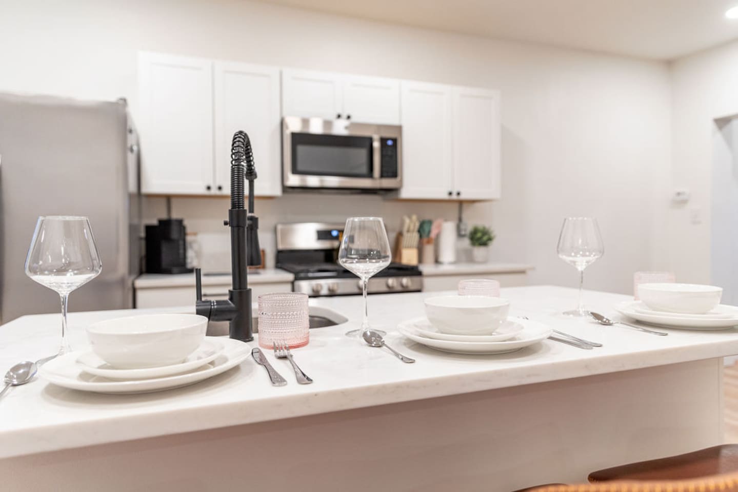 Chic kitchen dining countertop featuring a beautiful set of dishes, perfect for enjoying meals in style.