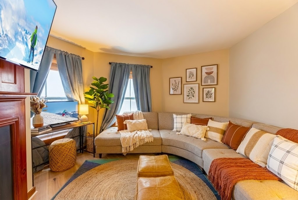 Cozy up by the fireplace in this spacious living room!