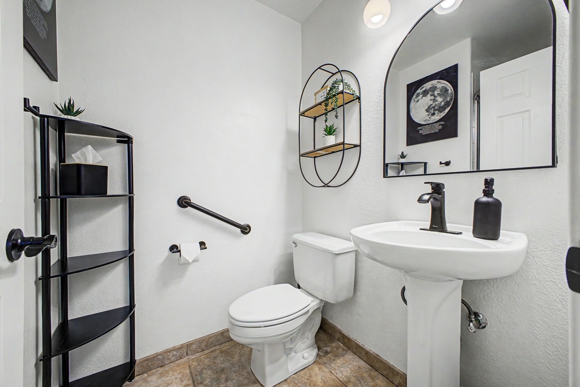 Main floor bathroom with shower right next to queen bedroom