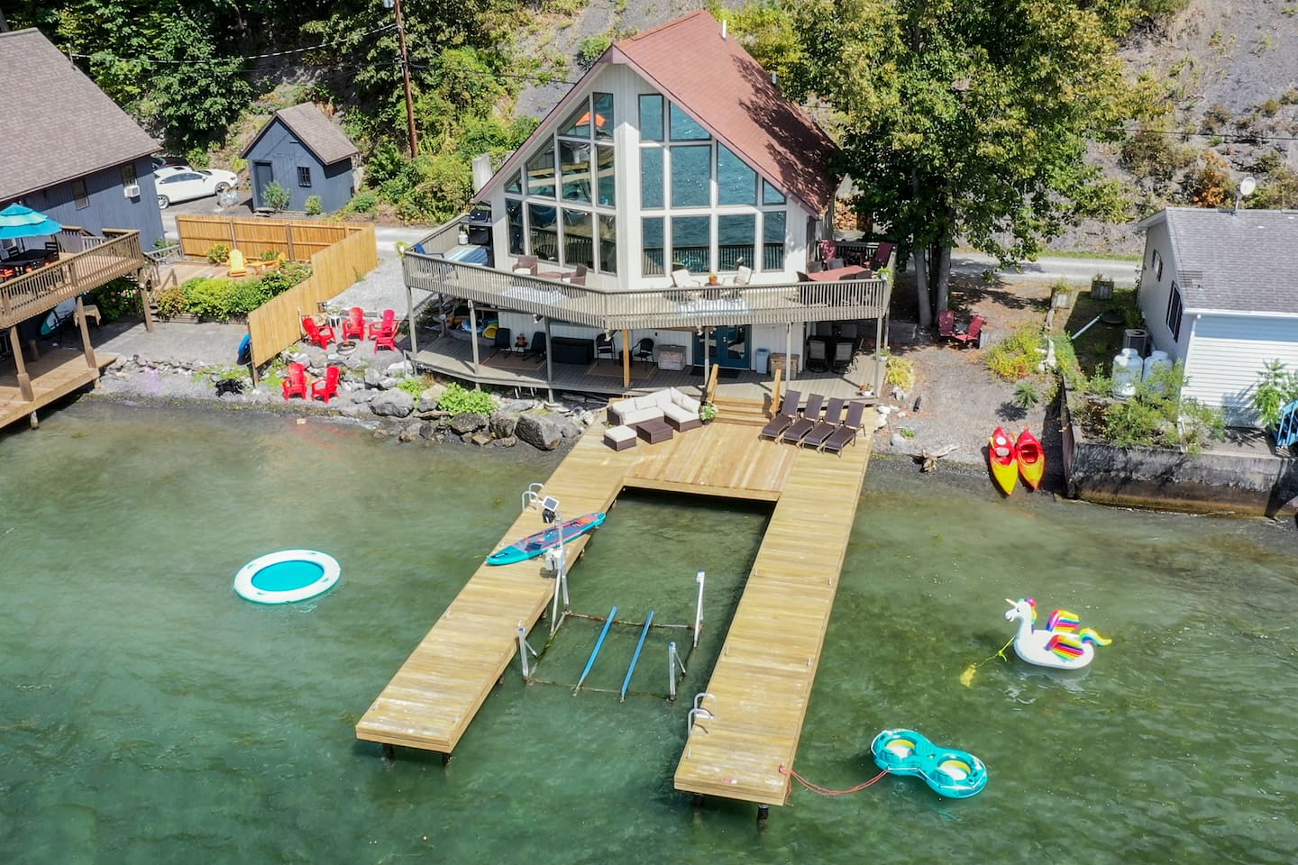 Enjoy breathtaking sunsets as you enjoy a private beach, boat hoist, fishing, kayaks, paddleboards, and more. This stunning retreat offers panoramic views for every floor of the house. Plus a game room, piano and outdoor seating, and lounges. 