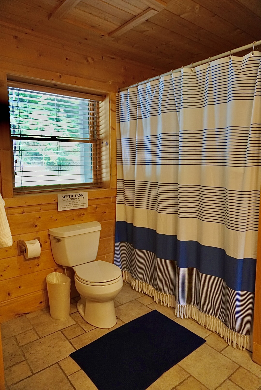 Bathroom Retreat: Bright space with natural light and nautical charm for refreshing moments!