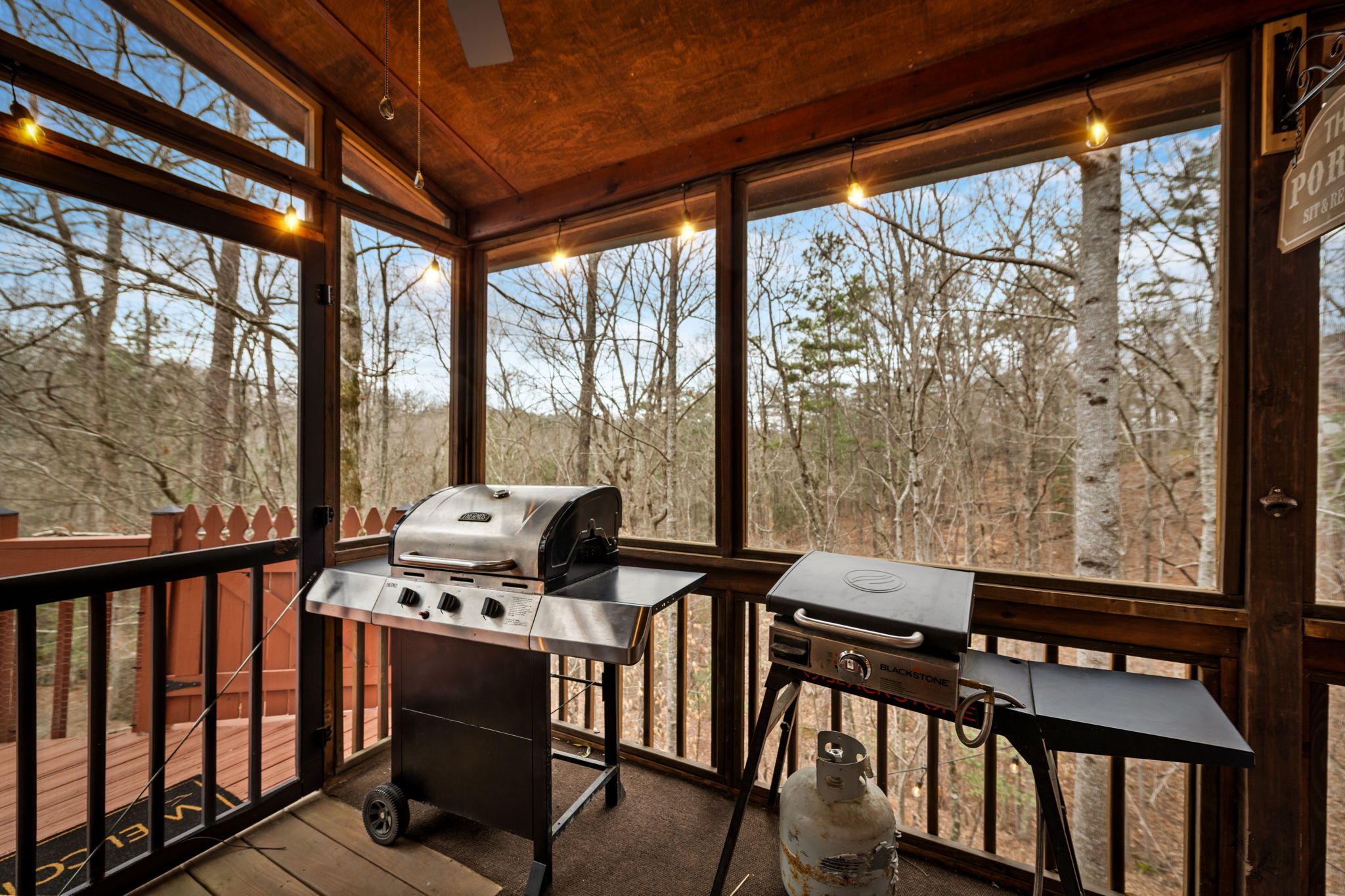 The cabin’s porch features a grill—perfect for relaxing and enjoying a sizzling meal outdoors.