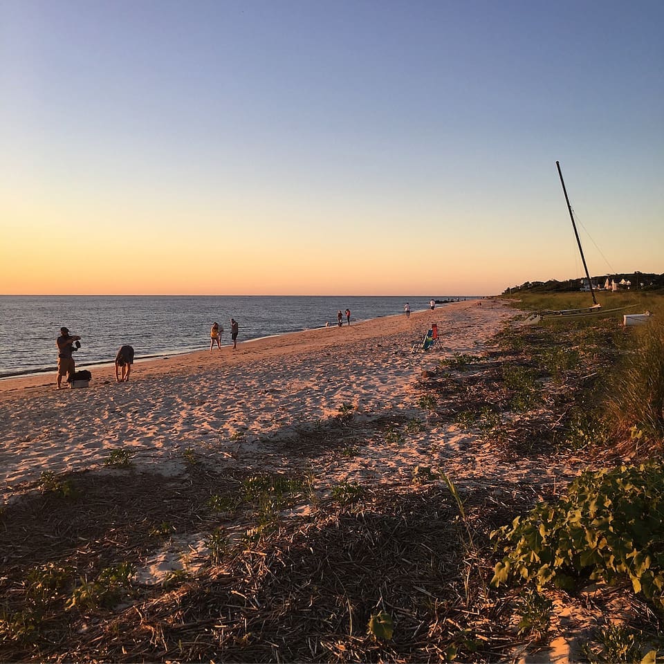 Enjoy the expansive sandy shoreline and calm ocean waves, making it the perfect spot for a tranquil walk or unwind by the water's edge.