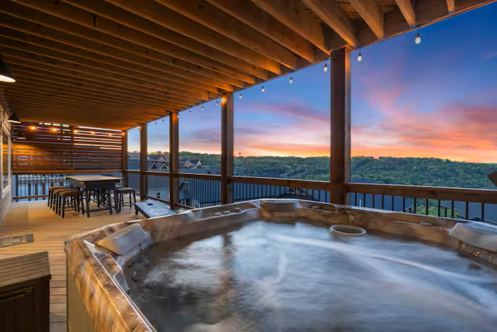 Great view of the sunset behind the Ozark hills from the seven-person hot tub.