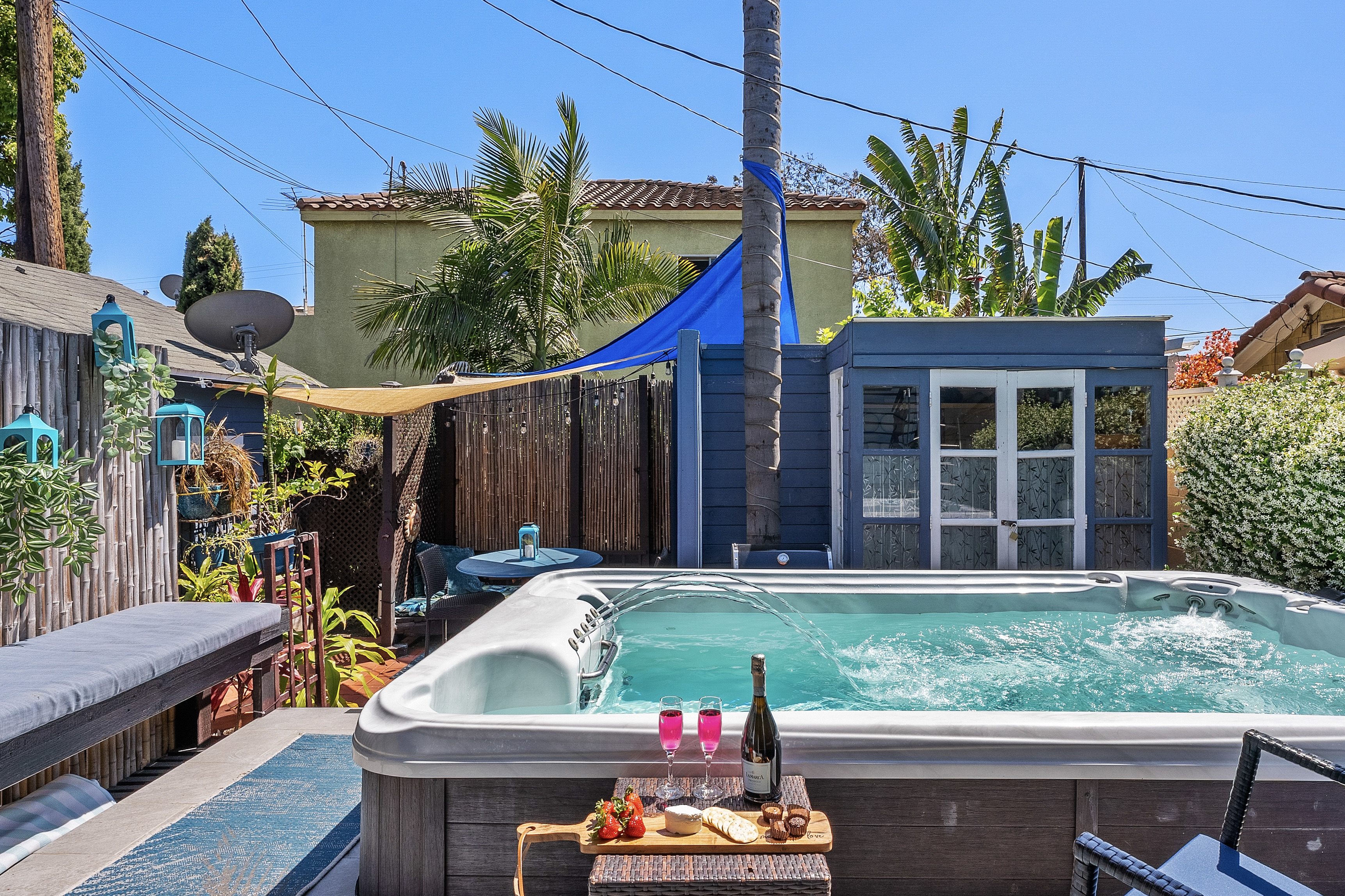 Relax and recharge in the spacious hot tub in a private backyard setting.