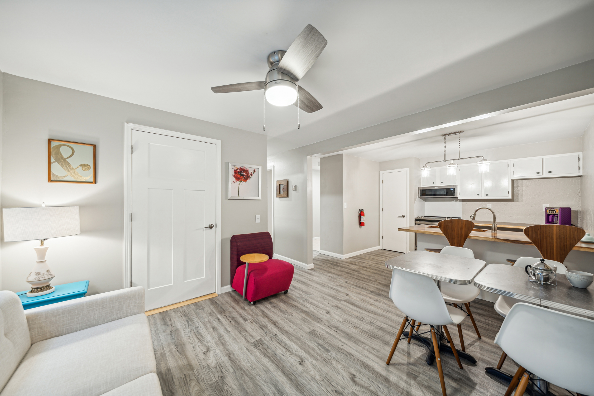 The common area and kitchen flow together in the downstairs apartment.