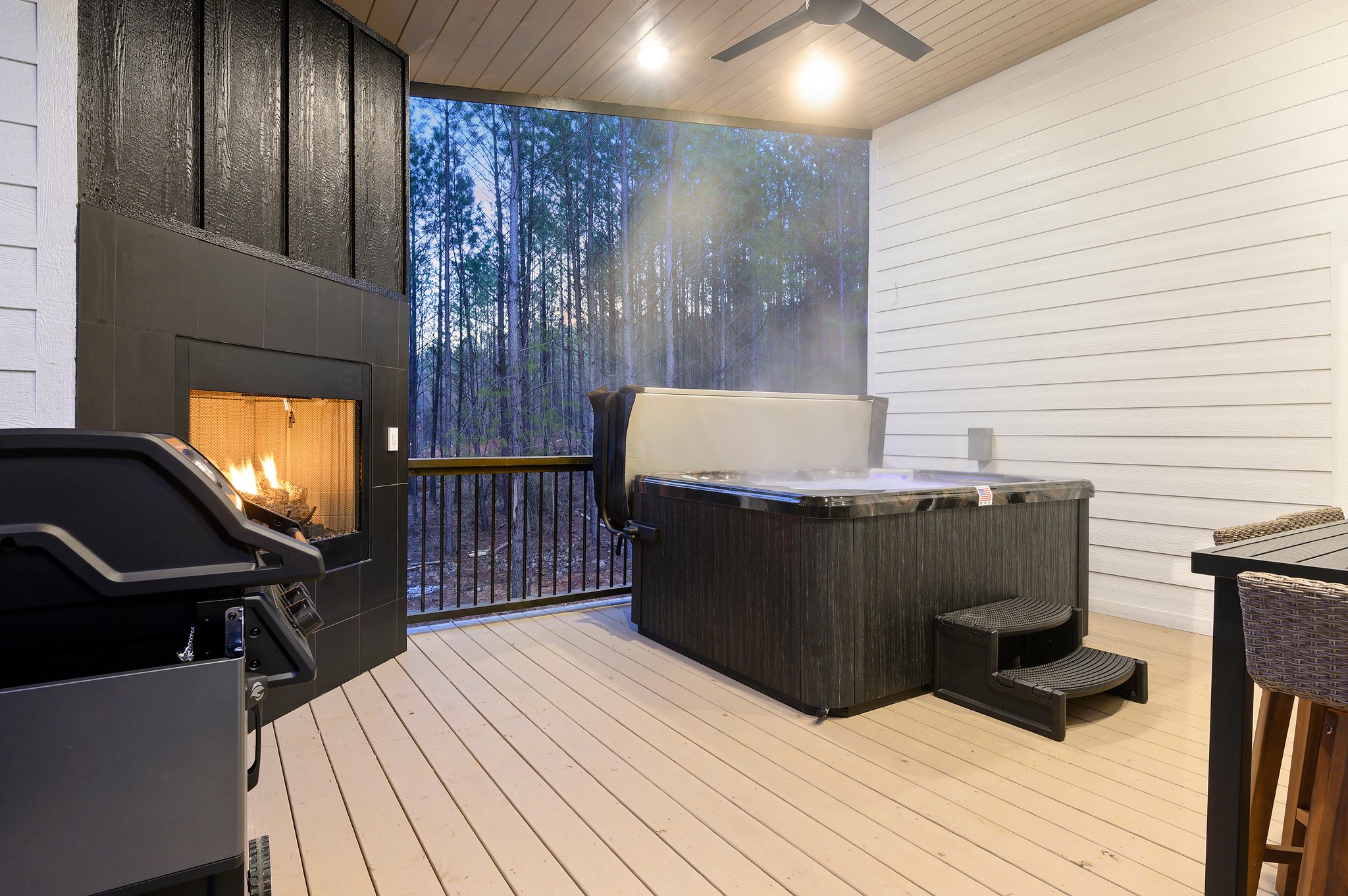 Your perfect night in: crackling fire, warm soak, and quiet pines