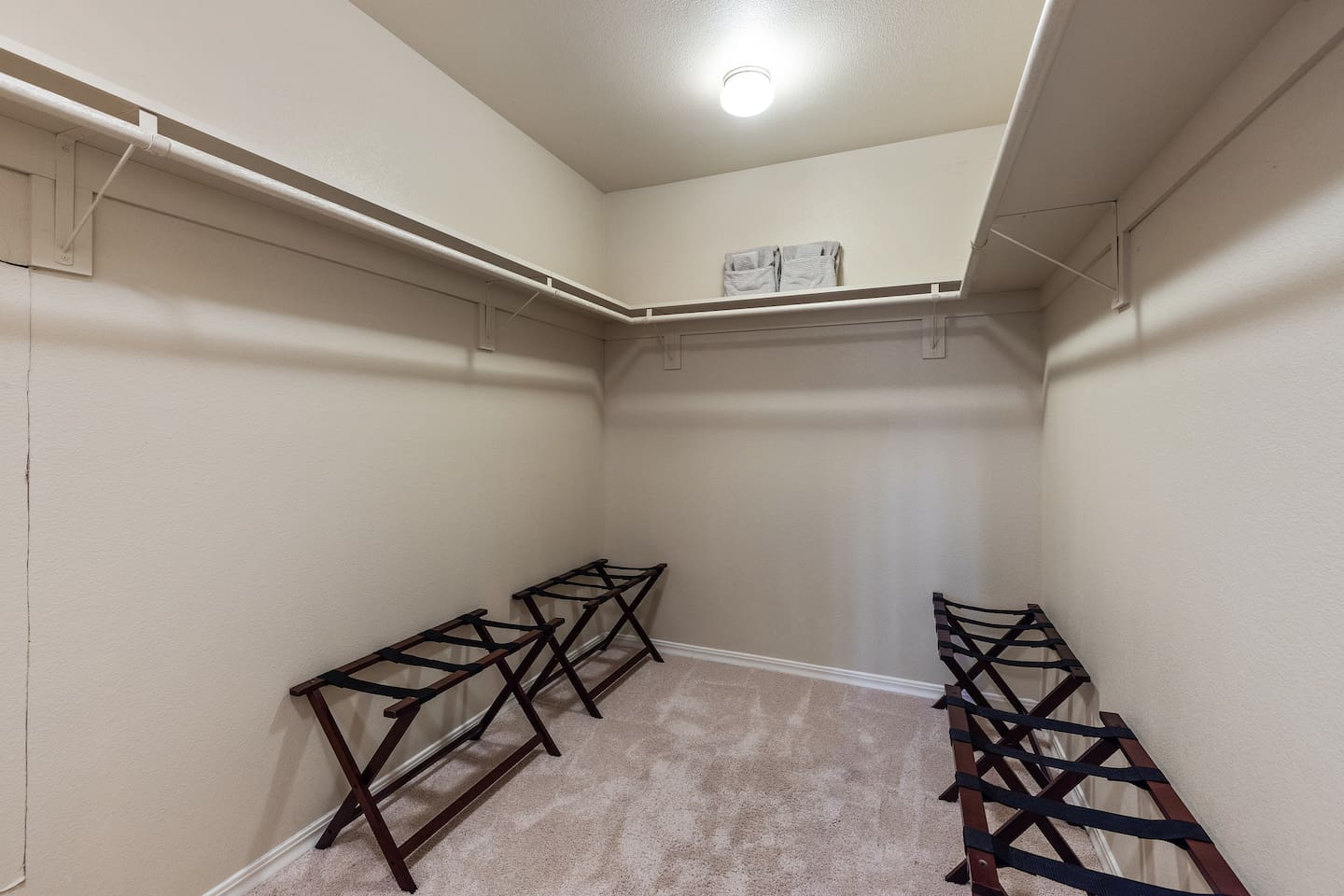 Primary bedroom's very large walk-in closet.