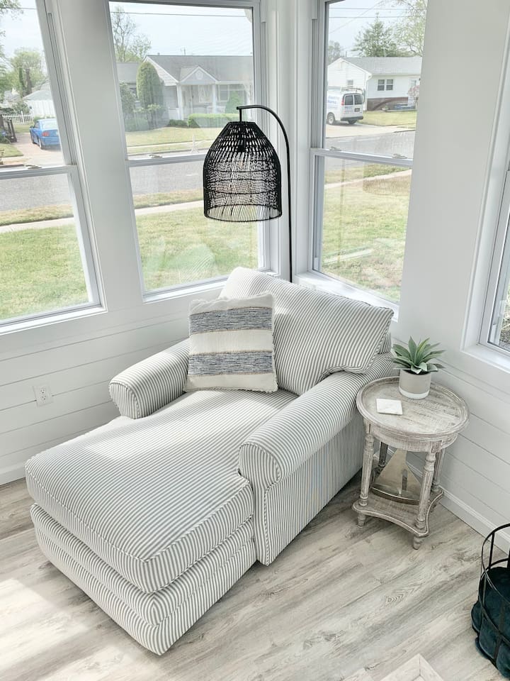 Stretch out and relax in this oversized striped chaise lounge. Tucked into a sunlit corner with a rustic side table, it’s the perfect spot for a peaceful afternoon nap or catching up on your favorite book.