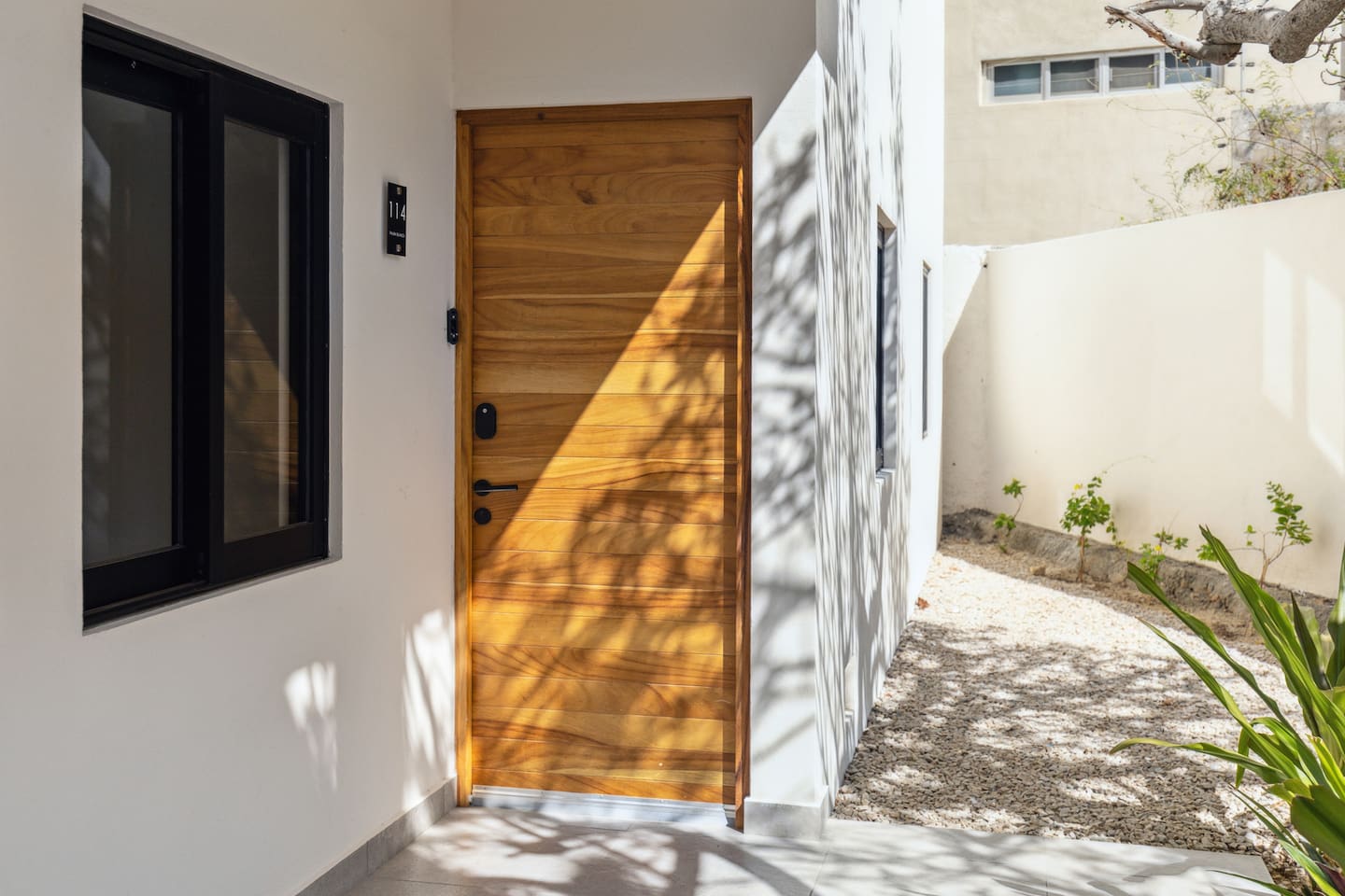 Welcome guests through our Cabo front door, crafted from solid wood with a sleek keyless lock. This secure, welcoming entry marks the start of your getaway vacation.