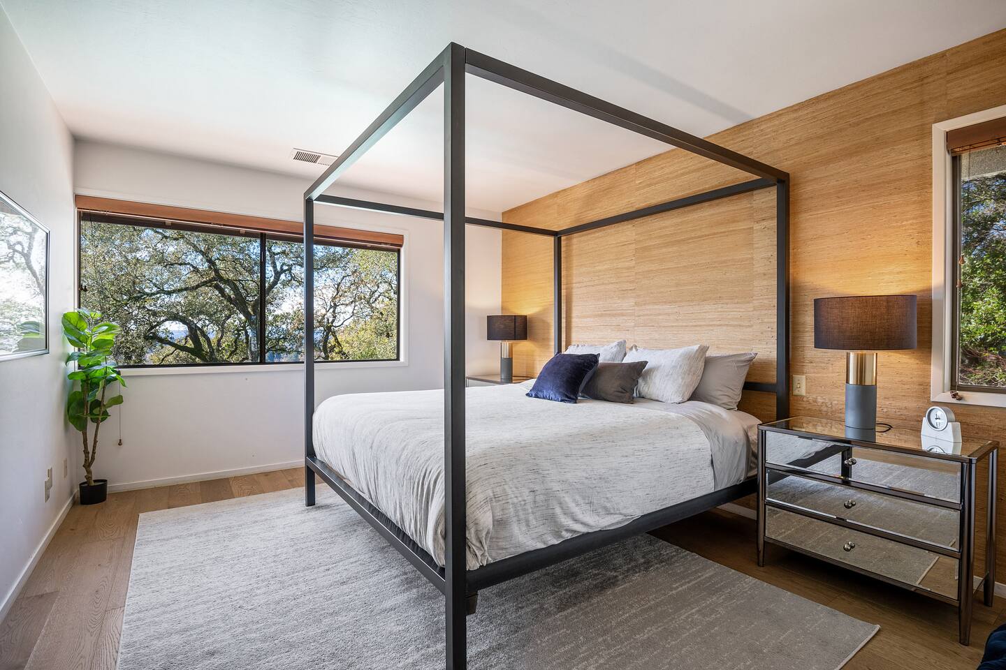 Primary suite with king bed, walk-in closet, and private full bathroom.