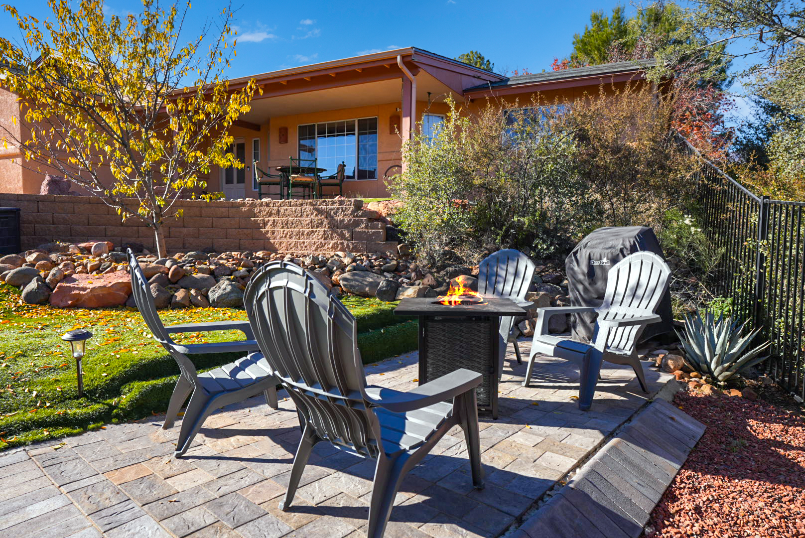 Gather around the fire pit with Adirondack chairs and a propane BBQ—perfect for evenings under the stars.