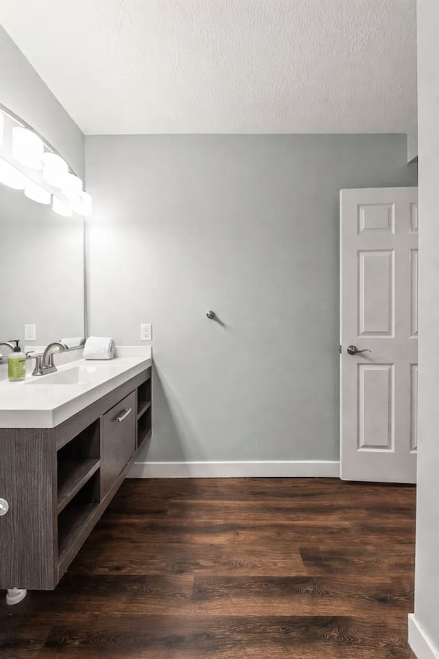 Spacious vanity area with contemporary lighting, large mirror, and plenty of room for daily routines.