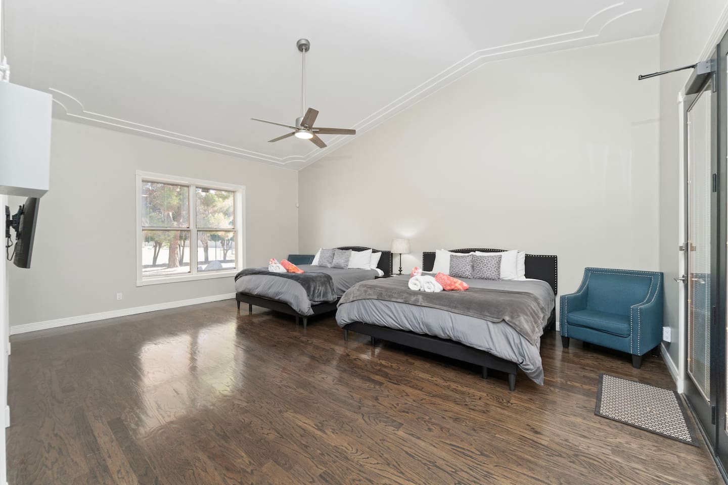  This inviting guest room features two plush king beds, perfect for friends or family to relax together in style.