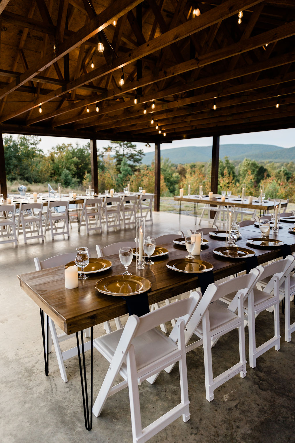 Covered patio dining setup for wedding and event guests.