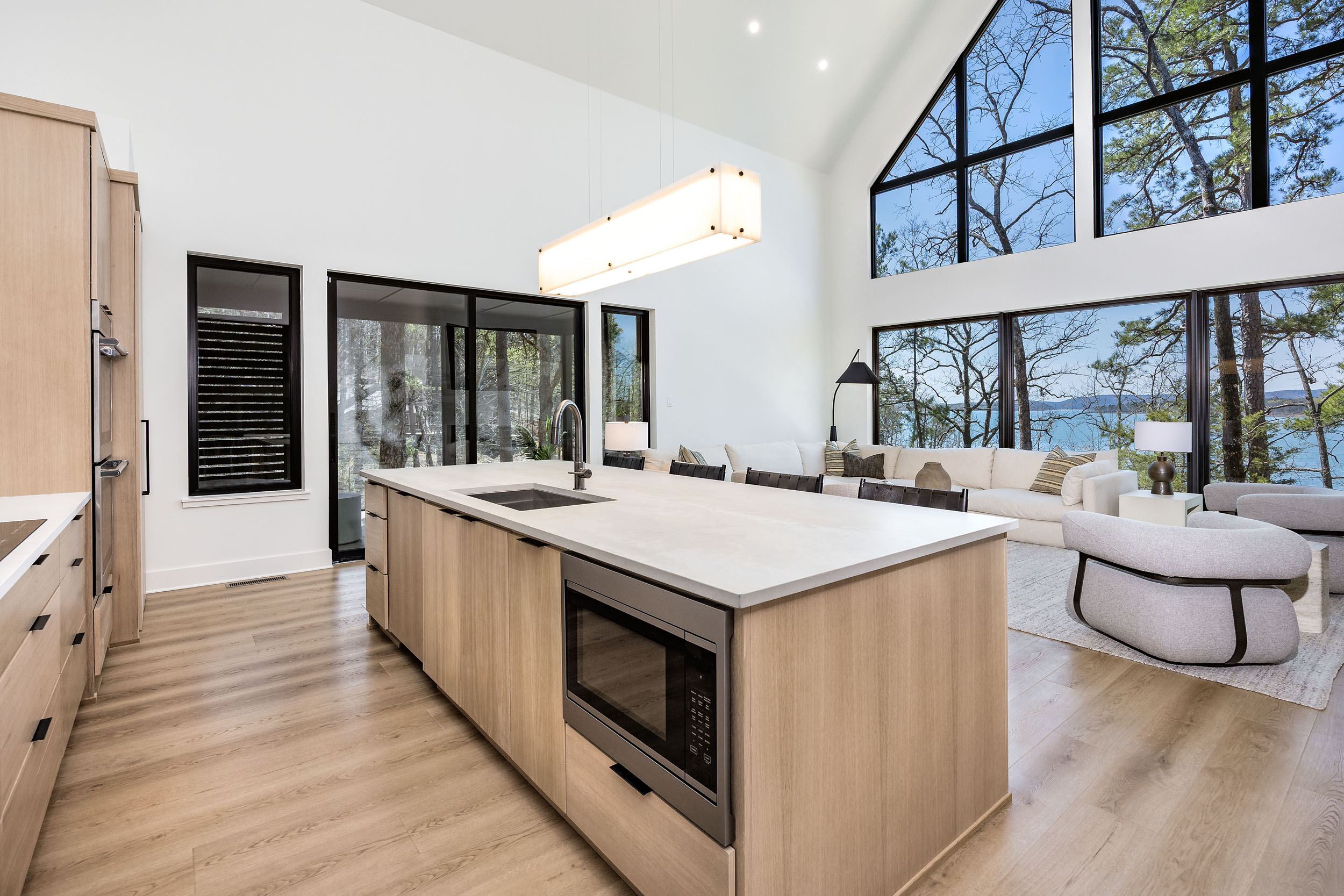 Enjoy stunning lake views while you cook in this open-concept kitchen that flows effortlessly into the living space.