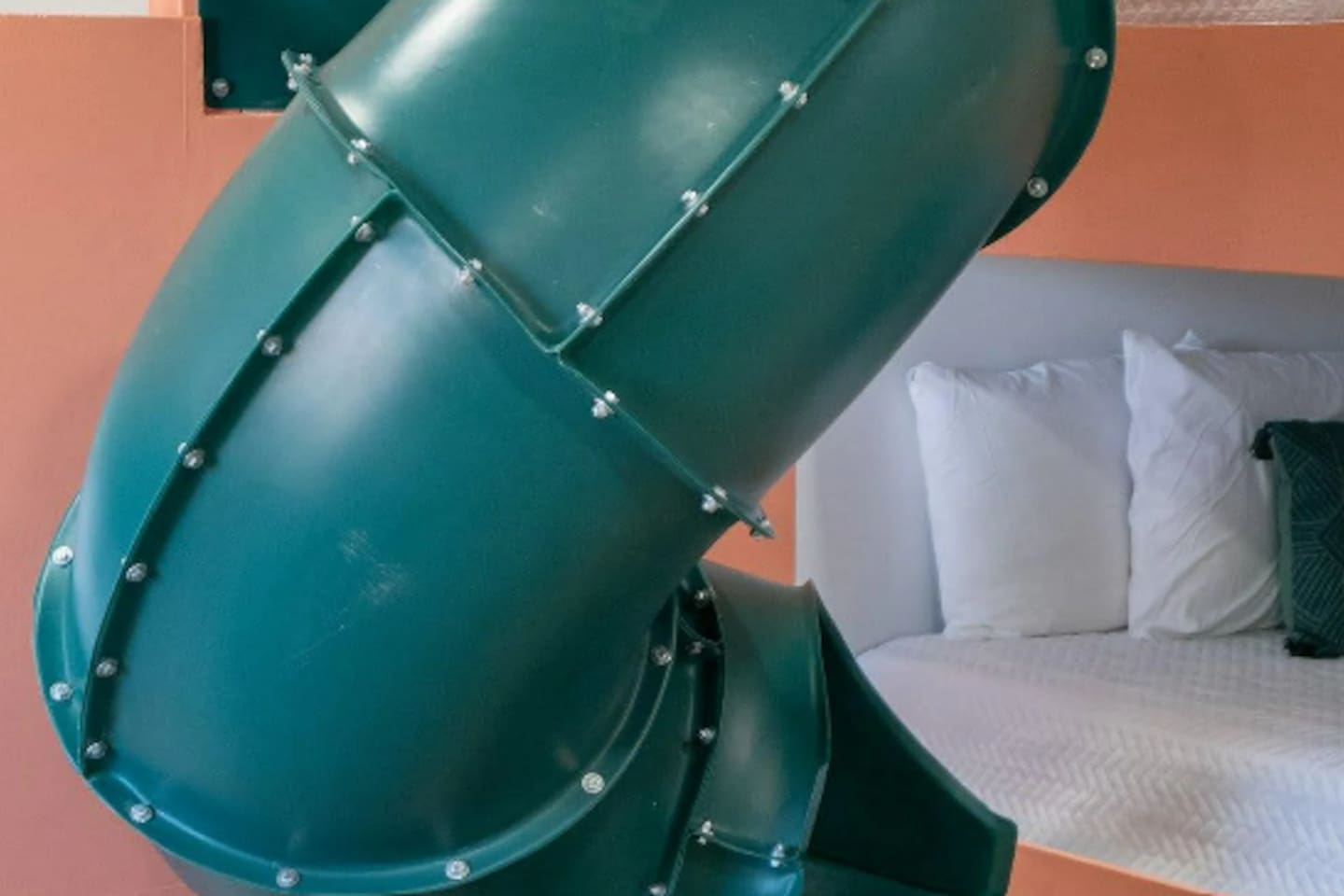 Why take the stairs when there's a slide? This built-in tube turns "time for bed" into the best part of the day, top bunk to floor in three seconds flat.