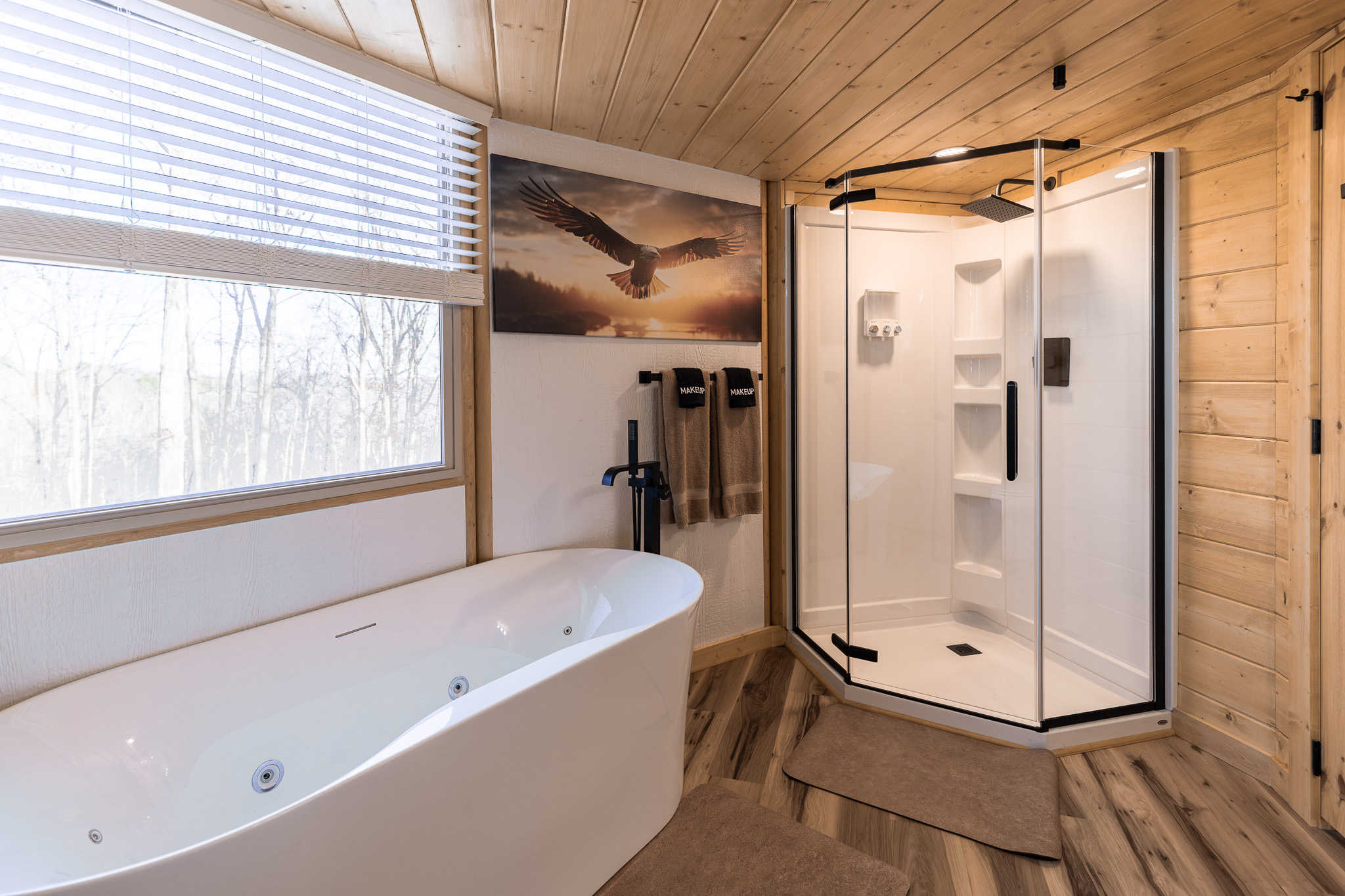 Relax in the spa-style bathroom featuring a deep soaking tub and walk-in rain shower.