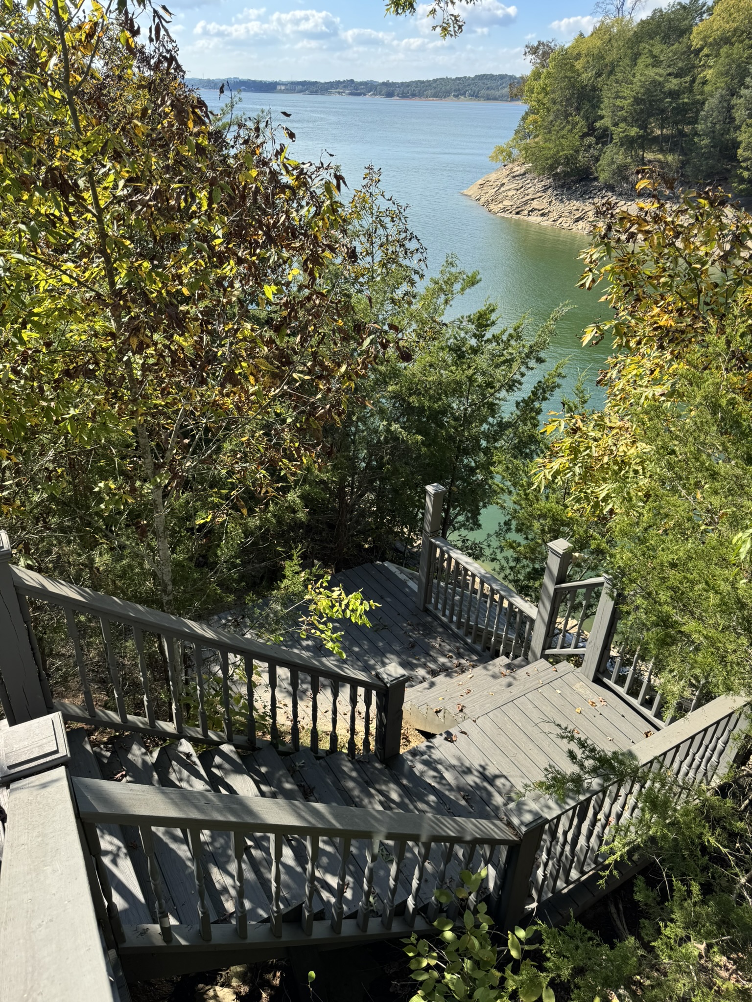 Stairway leading down to dock, firepit/seating area and rocky bluff