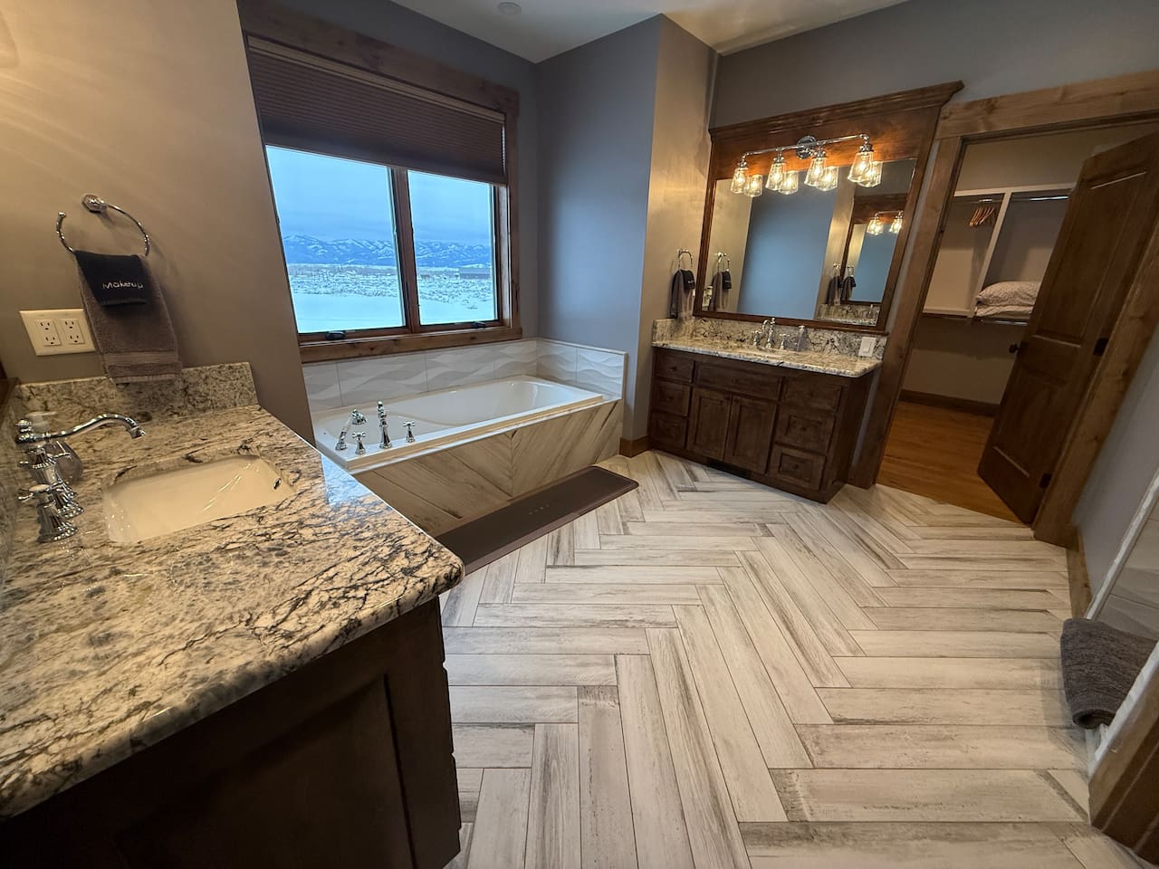 master bathroom with walk in shower and standalone soaking tub