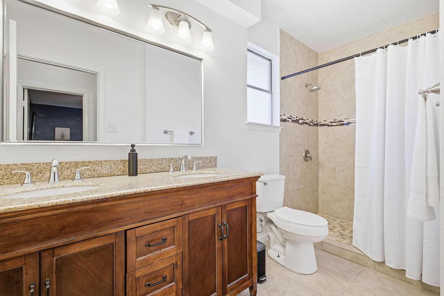 First-floor bathroom with walk-in shower; can serve as an en-suite for Bedroom 2 or be used as a guest bath