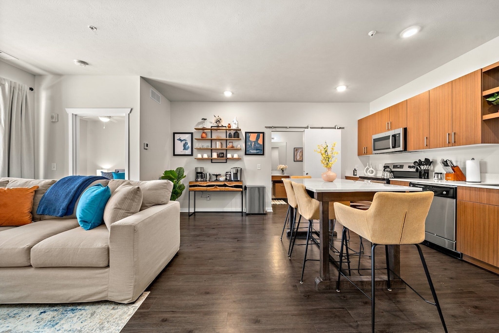 The kitchen is a welcoming space with an island that doubles as dining for 6.