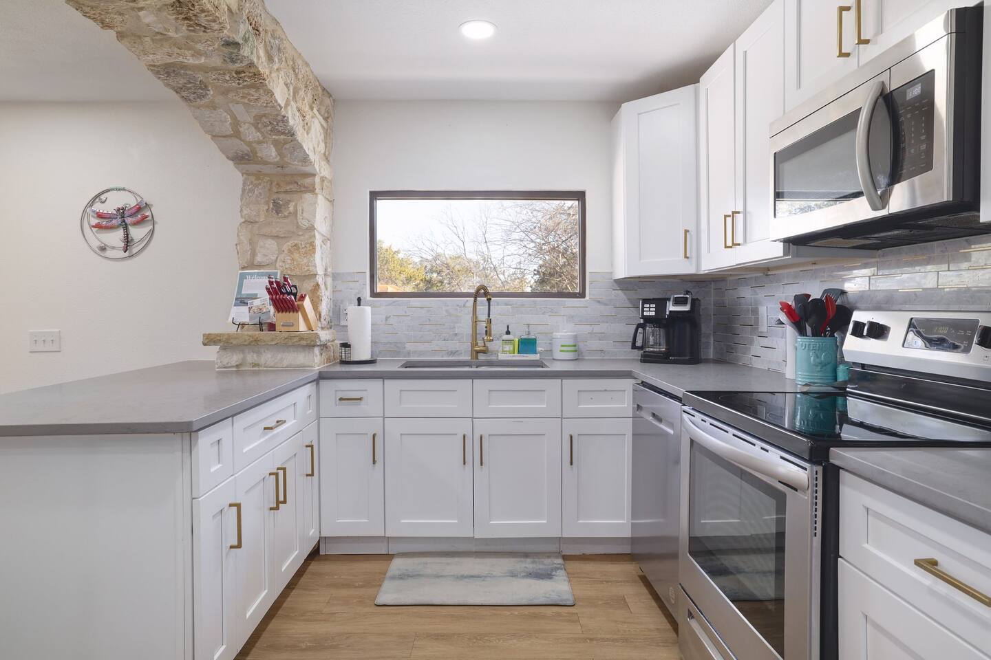 Bright, airy, and fully equipped, this kitchen makes everything from morning coffee to shared dinners feel easy and inviting. Modern finishes and natural light create a space guests naturally gather around.