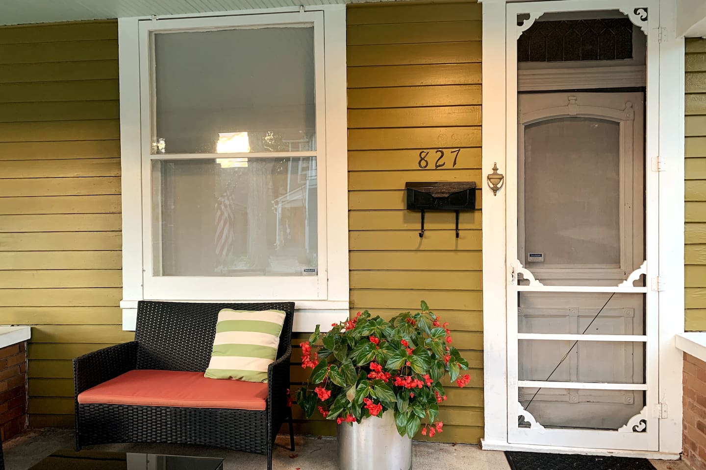 A closer look at the home’s early-1900s craftsmanship — original porch details, warm color palette, and timeless curbside charm.