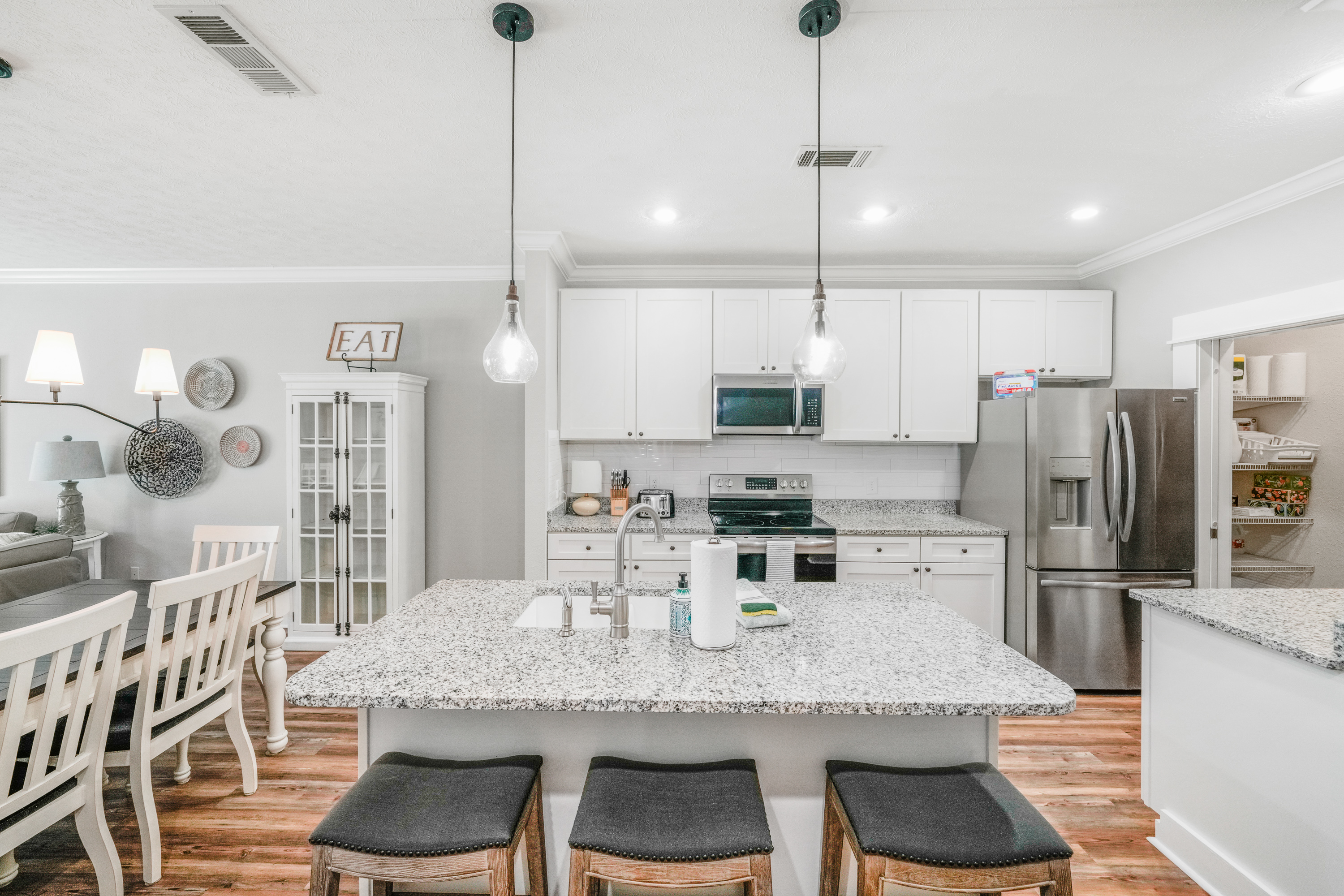 Enjoy a well-equipped kitchen that flows seamlessly into the dining and living areas