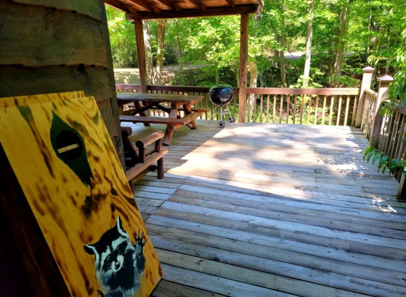 Large wrap round , fully enclosed deck with corn hole game