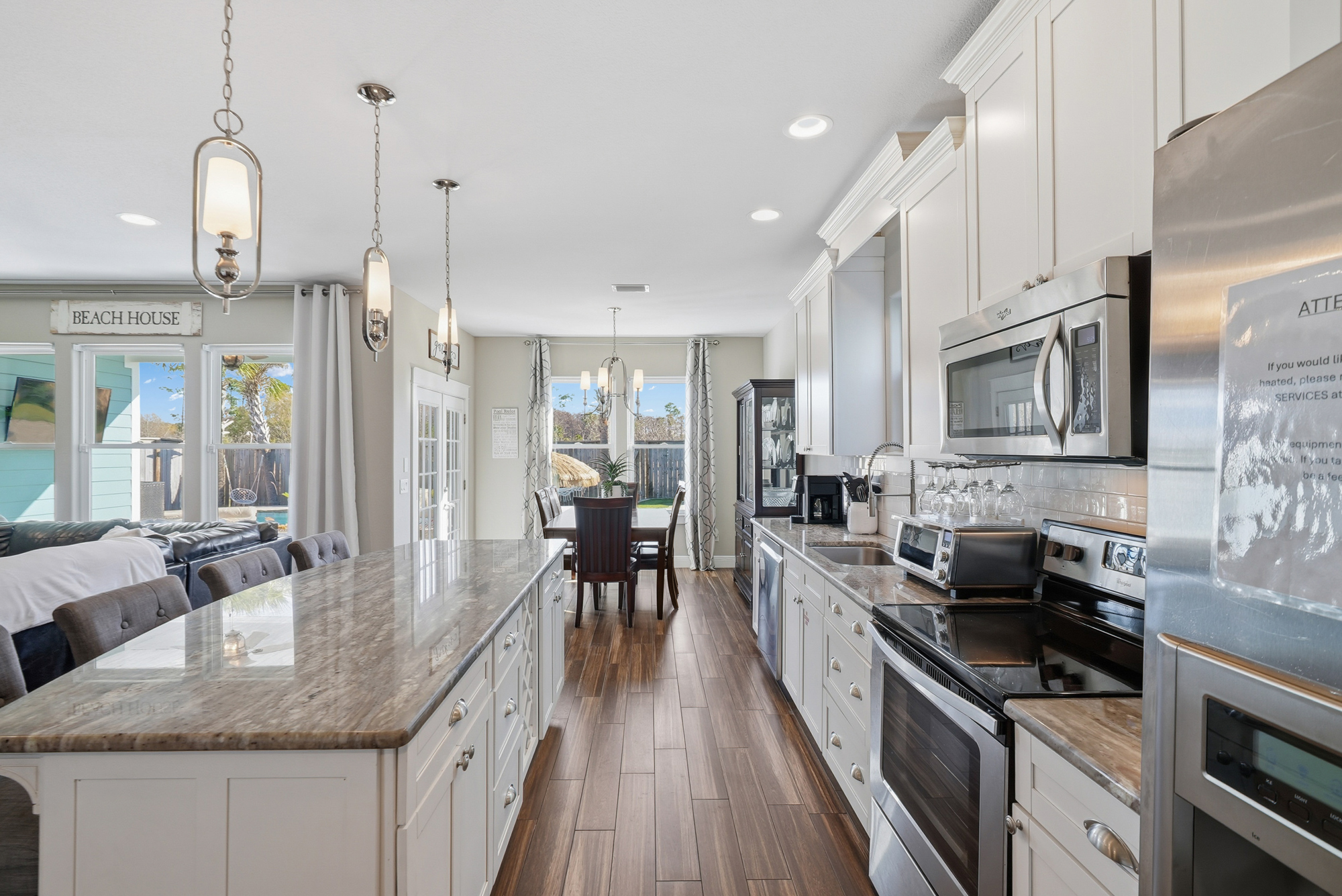 Relaxing living room with a large TV for movie nights after the beach, pool or Pier Park.