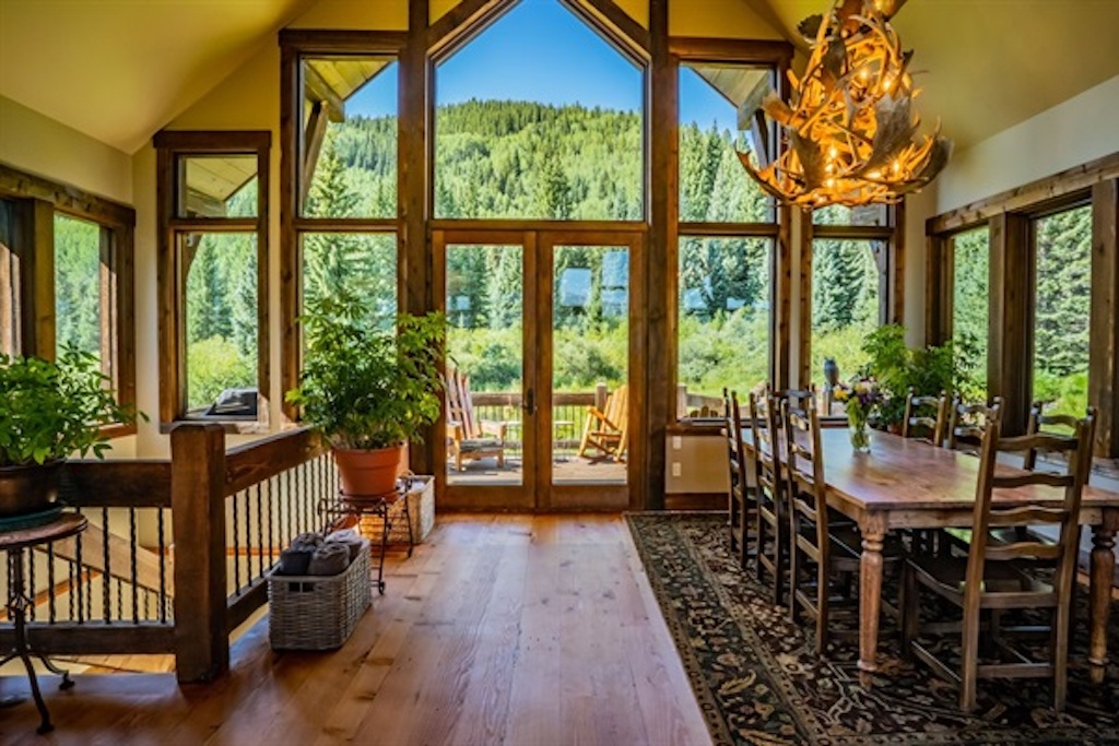 Main dining area, comfortably seats 8. Patio access to hot tub.