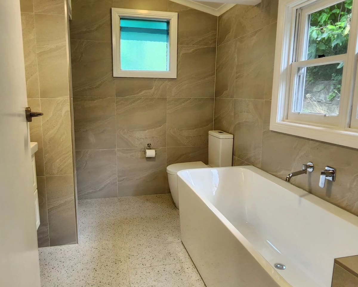 There are 2 bathrooms and 2 toilets. Both are brand new. One has a shower, and the other a massive bath (guest favourite). All body washes, haircare and even bubble bath are supplied. Basics supplied include washer/dryer, iron, hair-dryer etc.