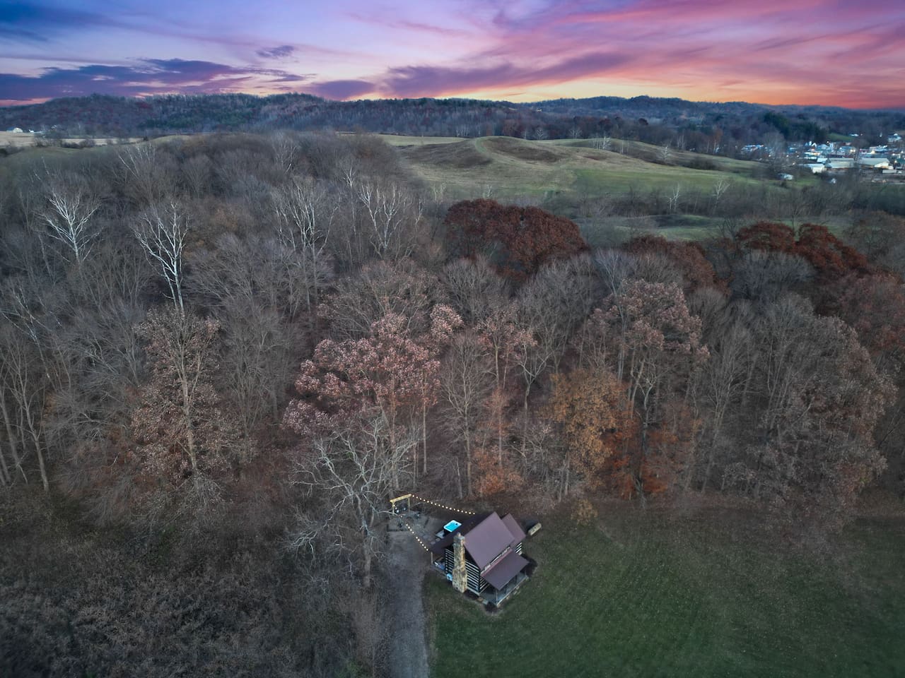 The cabin's drone shot reveals the breathtaking beauty that surrounds your enchanting retreat
