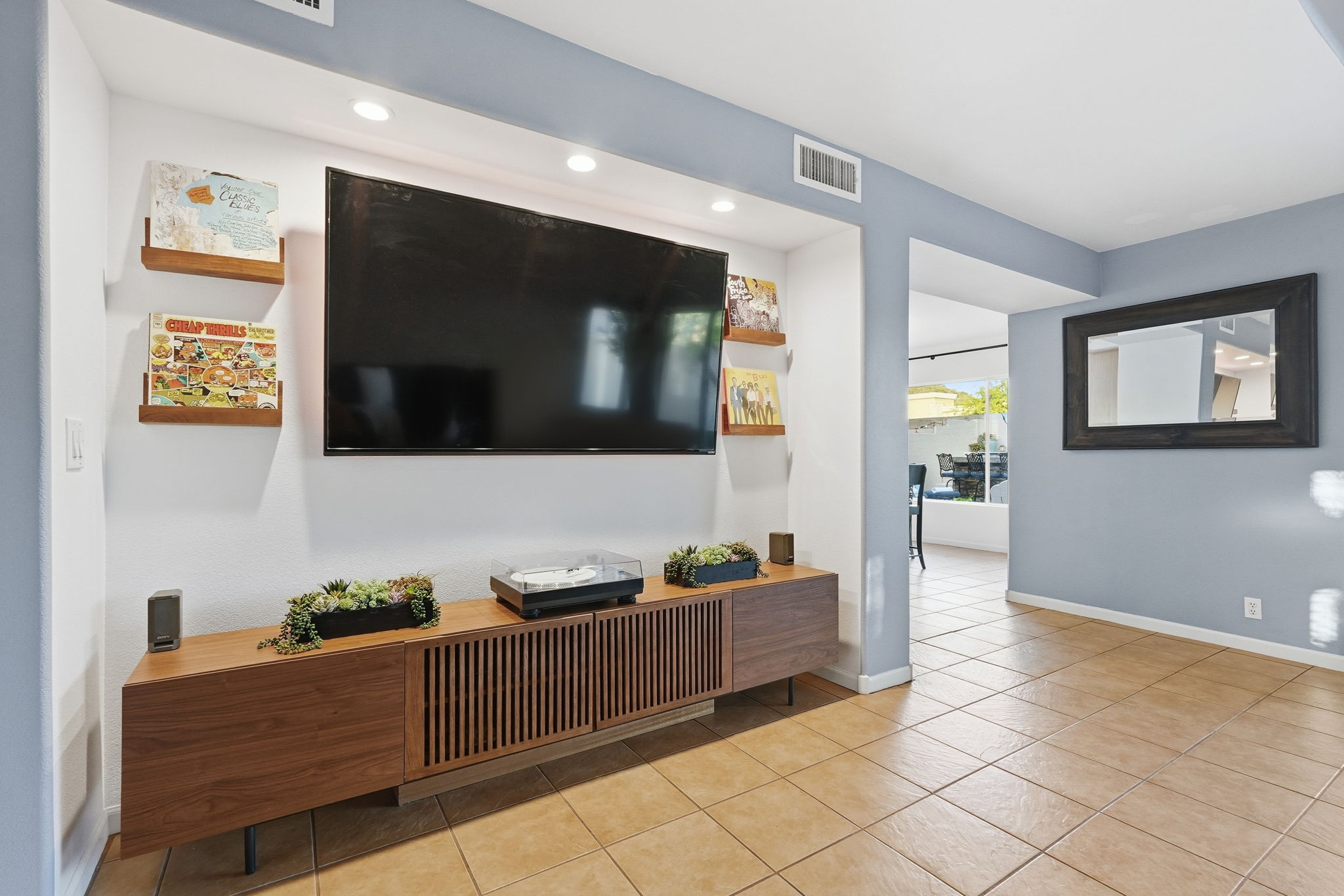 Smart TV setup in the living area with media console storage and easy access from the main lounge space.