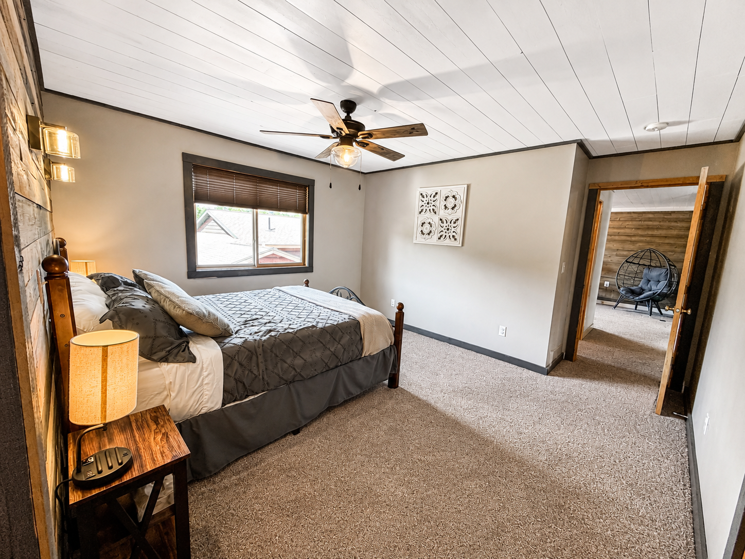 Another angle of the guest bedroom highlights the roomy layout and comfortable sleeping space.