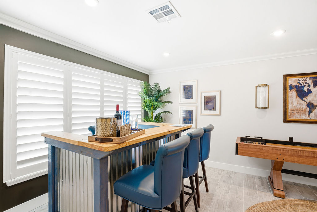 Pull up a seat and pour a drink at The Yacht Club’s bar.