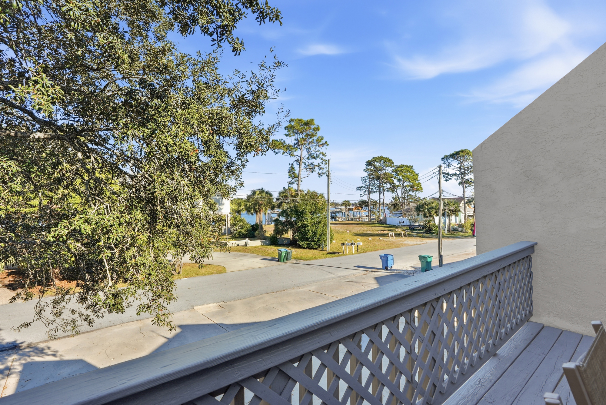 View From Front Balcony with Views of Grand Lagoon and Outdoor Seating