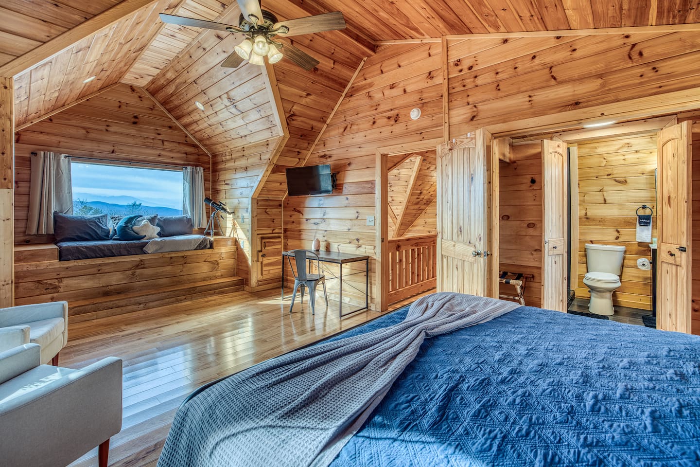 Huge window & amazing mountain views from one of the 2 upstairs bedrooms, both with a sleeping nook with a twin bed (and both also have a king bed and private bathrooms).