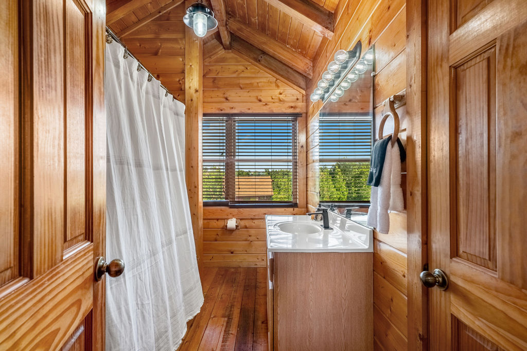 Rinse off the day or soak it in&mdash;this tub and shower combo blends rustic charm with everyday comfort, perfect for your mountain stay.