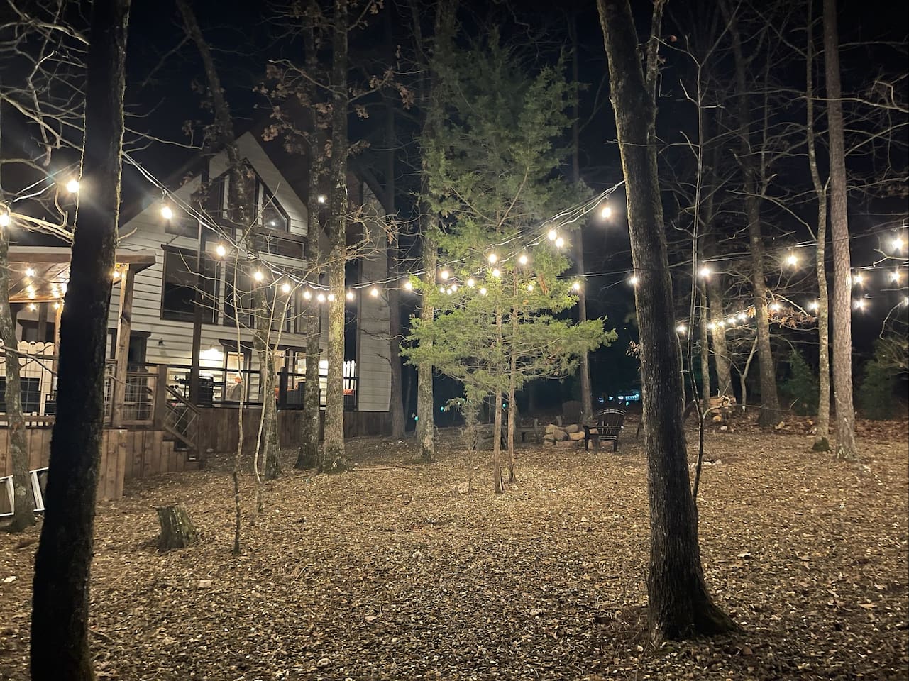 @vanillabeancabin overhead party lights, lighting up the Ouachita National Forest for a relaxing and peaceful setting!