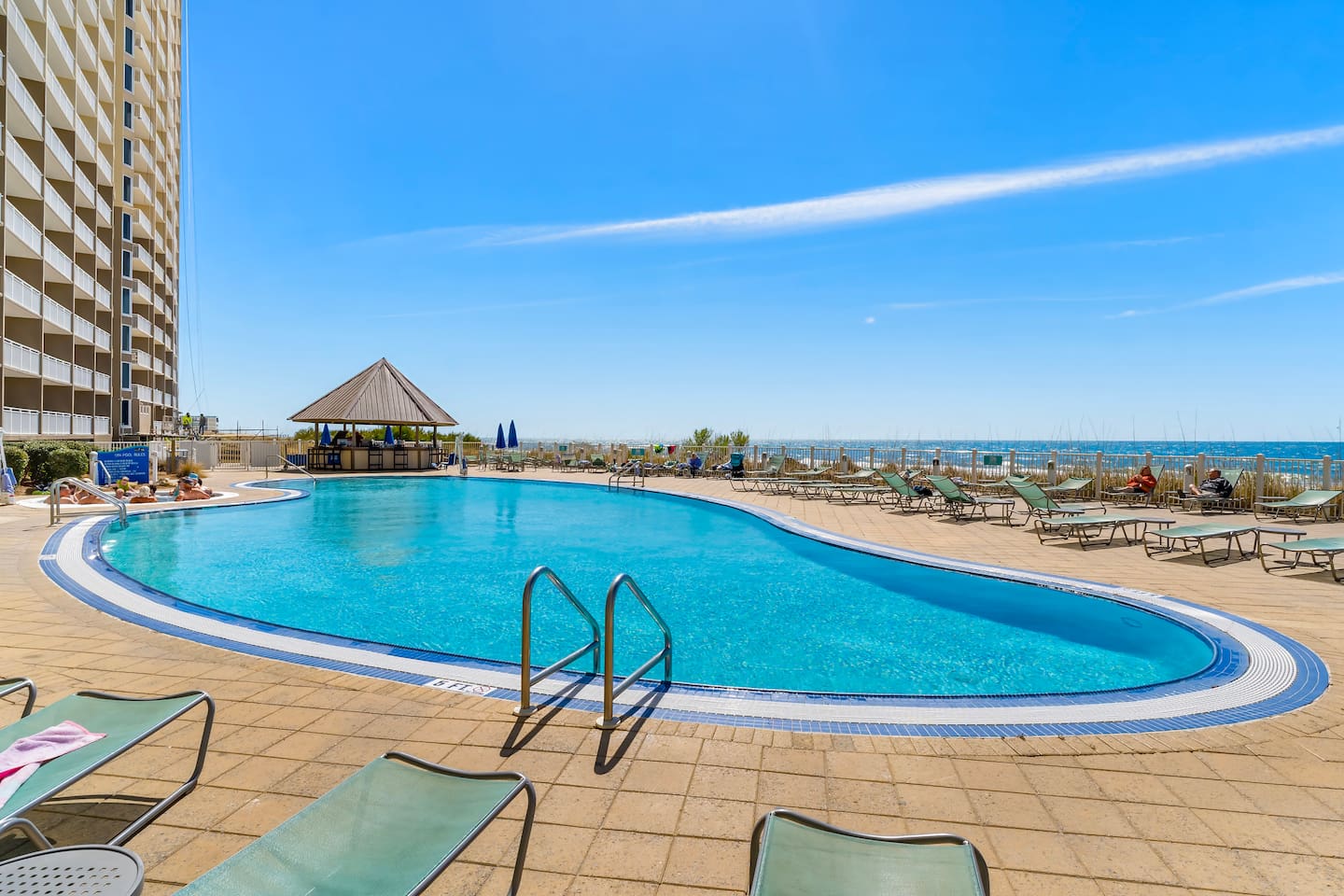 Take a dip in the beachfront pool just steps from the sand! Lounge under the sun, sip from the tiki bar, and soak up the stunning Gulf views—all without leaving the resort.