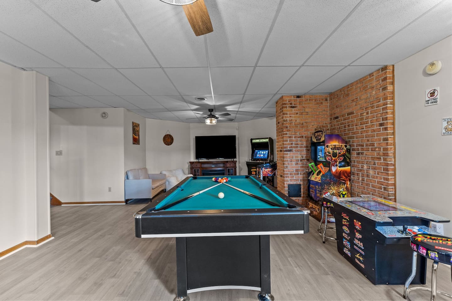 Game Room: Dive into fun with a billiard table, arcade games, and a cozy lounge area!