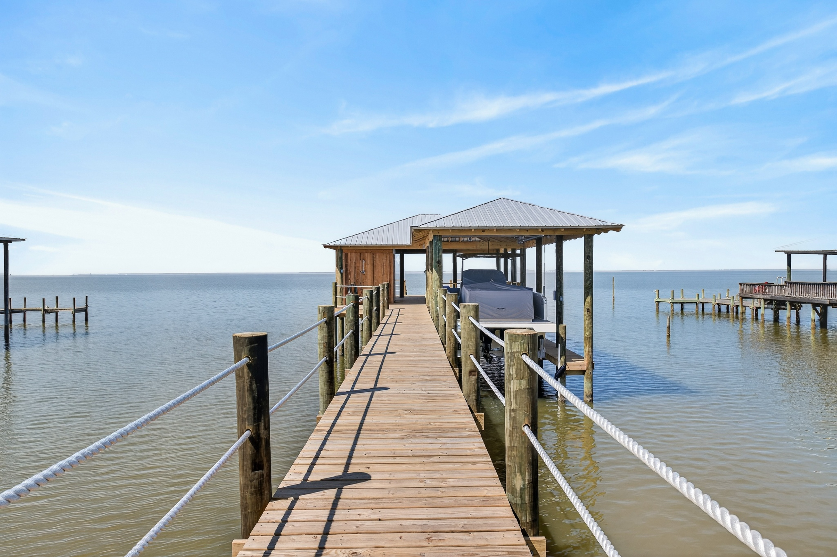 Private covered dock for lounging, fishing, or launching straight onto the water