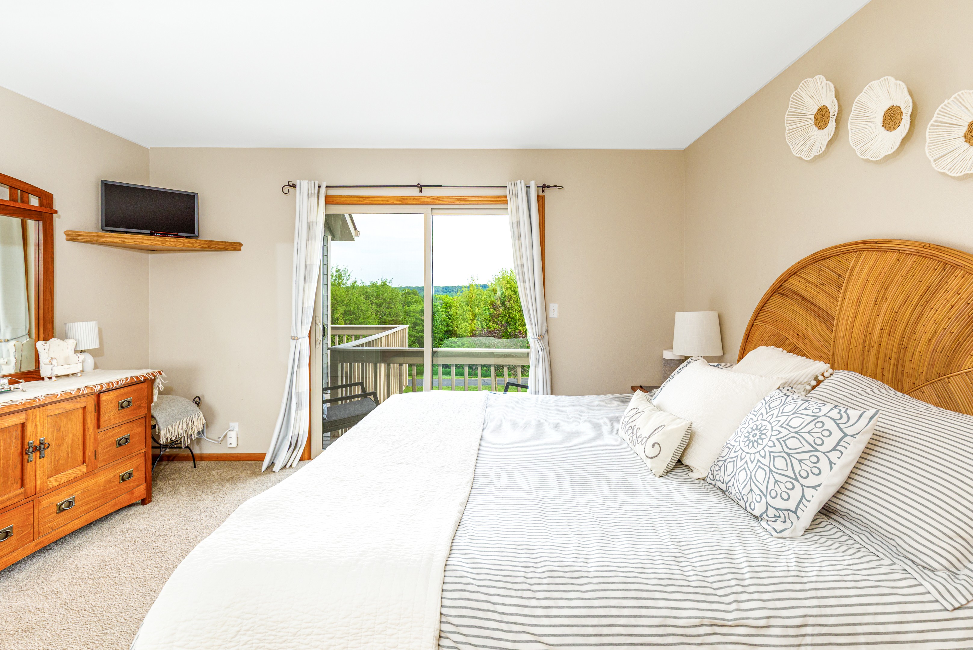 Main floor bedroom with ensuite bathroom and views of The Galena Territory